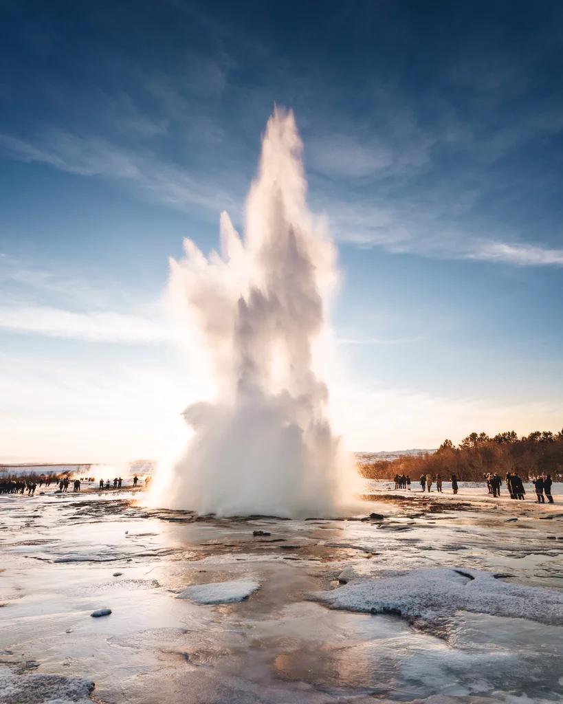 Geyser erupting in a winter landscape in Iceland