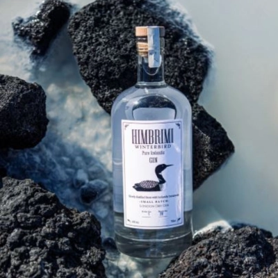 Himbrimi Winterbird Gin bottle standing between volcanic rocks