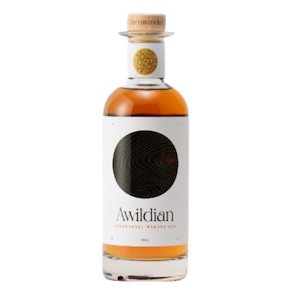 Bottle of Awildian Mānuka Barrel Aged Gin with amber colour and minimalist label.