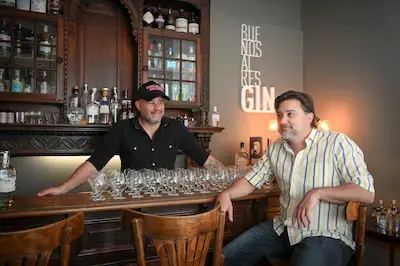 Founders of Buenos Aires Gin enjoying a cocktail together at the bar
