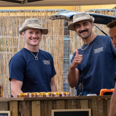 Founders of Zanzibar Liquor Company at a craft spirits festival — premium gin producers from England, United Kingdom