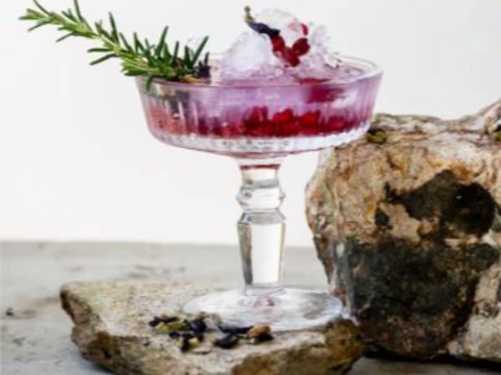 Awildian Blue Gin Tonic garnished with citrus peel in a tall glass
