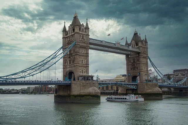 View of Tower Bridge in London with a boat on the River Thames