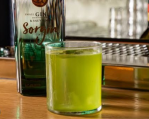 Basil Smash gin cocktail served over ice with fresh basil garnish