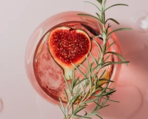 S Gin Rosé Ginto’ garnished with fig and rosemary