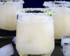 TAHU Margarita cocktail served over ice with a salted rim and lime garnish