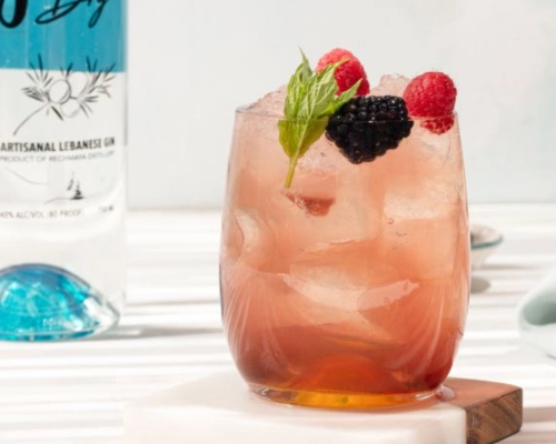 Jun Bramble gin cocktail with crushed ice and fresh berries
