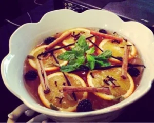 V2C Gin Punch Bowl with orange slices, cinnamon sticks, blackberries, mint and cloves — premium craft gin party cocktail from Amsterdam