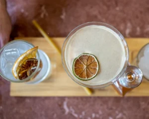 Dutch Blossom Martini cocktail with floral gin and dried citrus garnish in a coupe glass