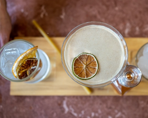 Dutch Blossom Martini cocktail with floral gin and dried citrus garnish in a coupe glass